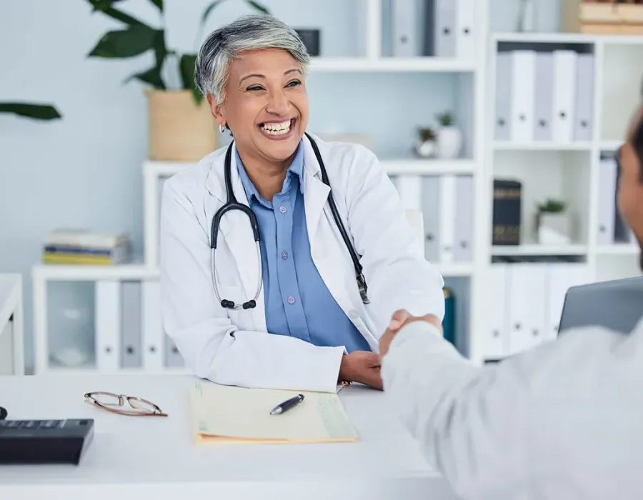 Public Health Nurse Shaking Hands with Nurse Manager